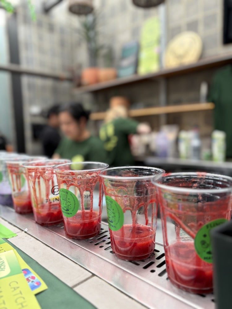 Strawberry iced matcha in Flinch cups